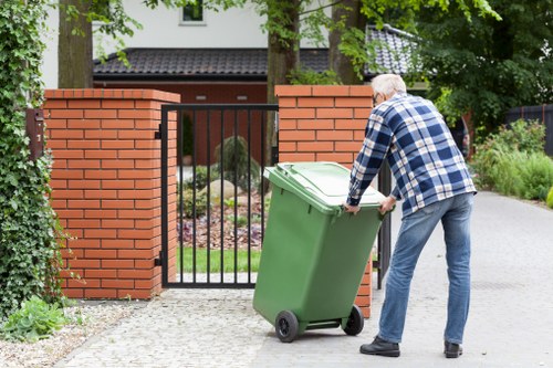 Driver giving a written quote for a garden tidy