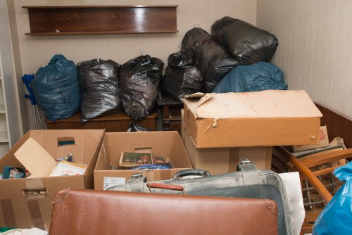 Professional movers handling household items in Staines